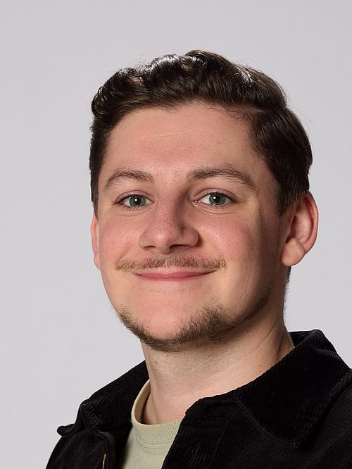 A portrait image of Benjamin Forster