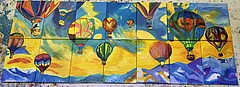 'The Sky is the Limit': A puzzle image showing hot air balloons on the sky. The picture is decided in 7 columns and two rows. The parts don't perfectly match.