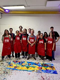 The research group behind the collaborative picture lying on the floor
